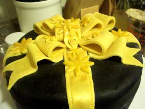 fondant suitcase cake - Gold Ribbon Fondant Cake (My first Fondant Cake) I used Satin Ice fondant for black fondant (its tastier). For the ribbon, I used the Wilton white fondant an...