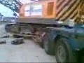 Kobelco op dieplader