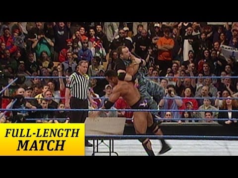 Rock - Can The Rock survive a Handicap Tables Match? Find out in this SmackDown classic!