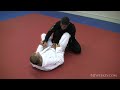 www.bjjweekly.com Ricardo De La Riva shows us a nice reverse hook sweep using the standard DLR as a setup but sweeping with the opposite hook. This set up is a little different because you are using the same side sleeve grips. Your second hook comes in over the top of the arm and then under the hamstring. Off balance your opponent and then make space for the sweep by scooting your hips away. Finish in side control.