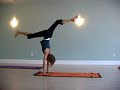One handed handstands, standing up from wheel, hand stand splits, dropping back to wheel, formidable face pose prep, scorpion, handstand variations, falling down and getting upJordan Anderson, Hannah Hipps, and Clayton Woodson take some time away from their yoga flow, to play with and explore new (to them) poses. Clayton tries a one handed handstand away from the wall with a spot from Hannah. By applying inward pressure on Clayton's legs, Hannah enables Clayton to fully energize and lift up through his entire body and, well, the hand just floats up. Hannah and Jordan experiment with a rocking tick-tock motion in their wheels as a preparation for standing up from wheel. Popping the hands off the ground in full wheel is harder than it looks.