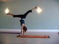 Yoga teachers practice handstand and backbend variations