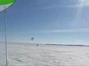 Kite skiing on a beautifull day