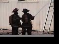 Detroit Fire Fighters Battle Fire - bricks almost crush lady
