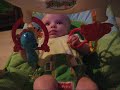 audrey is enjoying her rain forest bouncer.