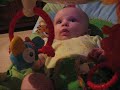 audrey is enjoying her rain forest bouncer.