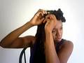 Putting Bantu Knots in locs