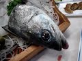 Eating a freshly killed squirming fish Eating a freshly killed squirming fish