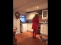 Tart in a red PVC Mac