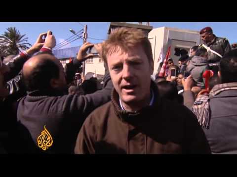 Clashes break out as Tunisian politician is laid to rest