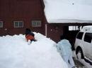 Leslie and Zander jumping in the snow