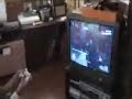 Old woman plays shooters game on console