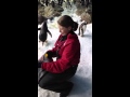 Jamie getting a hug from a King penguin