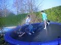 lads fighting for a ball on a trampoline