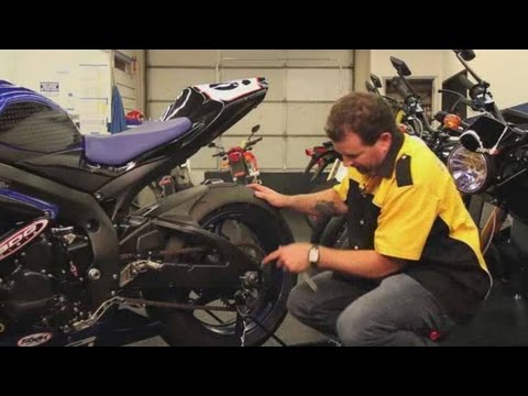 how to adjust a chain on a motorcycle