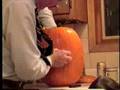 Earl Capehart carves Jack-O-Lantern