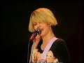 this is the second part of a performance from 12th august 1990. it was from one of a series of concerts to celebrate the 5th birthday of the town & country club (now the forum) in kentish town, north london. this event took place at the alexandra palace, also in north london. the running order for this concert was 29 palms, the 4 of us, voice of the beehive, squeeze and the kinks.

featured tracks are: i'm shooting cupid, beat of love, and say it.