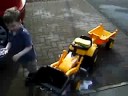 Andrew washing his toy JCB Digger