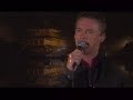 Russell Watson sings,\" You Raise Me Up \"