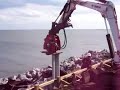 Compactor Plate Driving Everlast Seawall in North Carolina Compactor Plate Driving Everlast Seawall in North Carolina