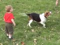 Patrick manages to get the stick away from the dog while Dad distracts him.
