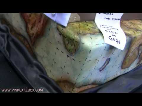 fondant suitcase cake - This luggage cake celebrates the 50th birthday for a man who loves to travel all over the world and loves antiques and old maps. We used warm colors for the ...