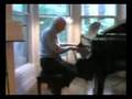 Granddad playing the piano in Boston