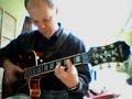 song i wrote and recorded a few years ago, played once more, for the webcam! it's  just a simple groove-latin tune, nice for octave playing.
about the octave playing, i generally use one of three right-hand techniques:
1. with plectrum, advantage is i can easily switch between octave and single note playing.
2. with thumb, montgomery style. nicest sound but sometimes difficult to hit (only) the right strings (for me at least)
3. strumming with index finger like i do here: it sounds a bit harsher, but still ok. advantage is i can use my right thumb to mute low strings and as a 'guide' for hitting the right strings. i can play more accurately in this way. i keep the plectrum between index and middle finger while i do this. changing back to plectrum takes a second (as you can see).