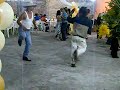 drunk men dancing at mexican party