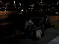 Man playing drums on buckets