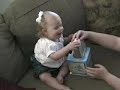 mara kate playing with her jack-in-the-box.