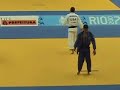 Ryan Reser (USA) throws Leandro Guilheiro (BRA) with an amazing te-guruma/ura-nage (very hard to classify) counter for ippon. The throw started on the edge of the fighting area and went outside. Under the new dynamic-edge rules this is a valid action and thus referee William Rosquet (CUB) was right to validate Reser's perfect scoring and dismiss the corner judge that was signaling an out-of-bounds action.My initial reaction, caught here on tape :-), was to call the judge many names since I wasn't aware of the new rule called 