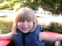 Zoe splashing in the raft