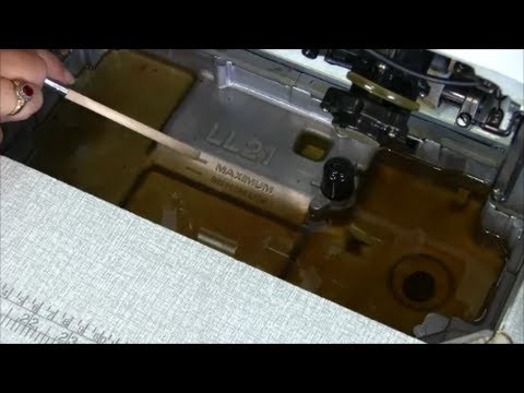 how to drain oil from a juki sewing machine