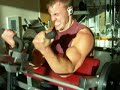 Cris doing Hammer Strength Preacher Curls
