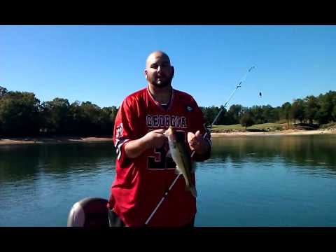 My friend Matt catches a spotted bass with a trout 