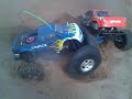 two hpi savage x in sand pit two hpi savage x in sand pit