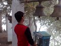 Sumit ringing a bell with his head