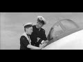naval officer david tomlinson argues with a sea scout about how an early jet fighter works and in doing so starts the engine and the backwash whips the uniforms off a nearby parade of wrens