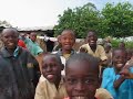 Local children catching a chicken