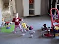 Emma pushing her doll stroller