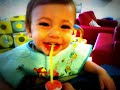 Yair Laughing while playing with straw