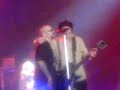 izzy stradlin playing onstage with guns n roses at the newcastle arena