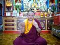 Drikung Kagyu Lama Sonam demonstrate the Mudra of 8 offering