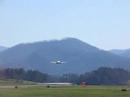 Mooney taking off from Macon Co. Airport