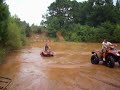 dj playin in the water on his honda rancher 420
