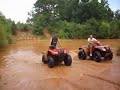 dj playin in the water on his honda rancher 420