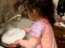Lonely baby does dishes