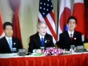 George W Bush is in Hanoi, Vietnam with south Korea President Roh Moo Hyun and Japan Prime Minister Shinzo Abe.