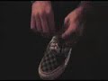 Nick Jonas tieing his shoes